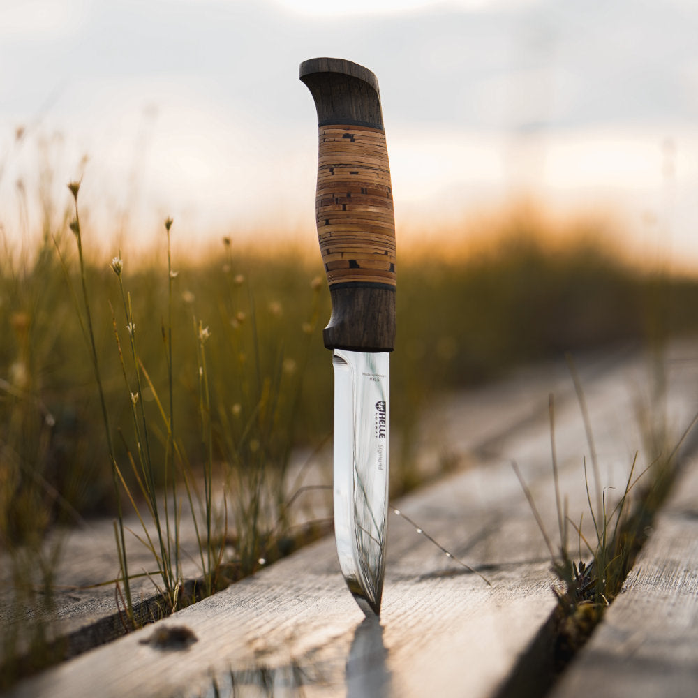 Helle Sigmund Dark Birch Outdoor Knife with Leather Sheath Outdoors at Sunrise