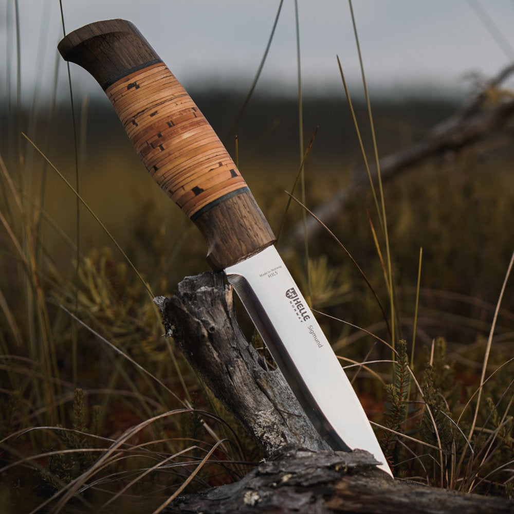 Helle Sigmund Dark Birch Outdoor Knife with Leather Sheath Outdoors Angled View