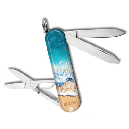 Victorinox Life's a Beach Classic SD Designer Swiss Army Knife Back View with Crashing Surf