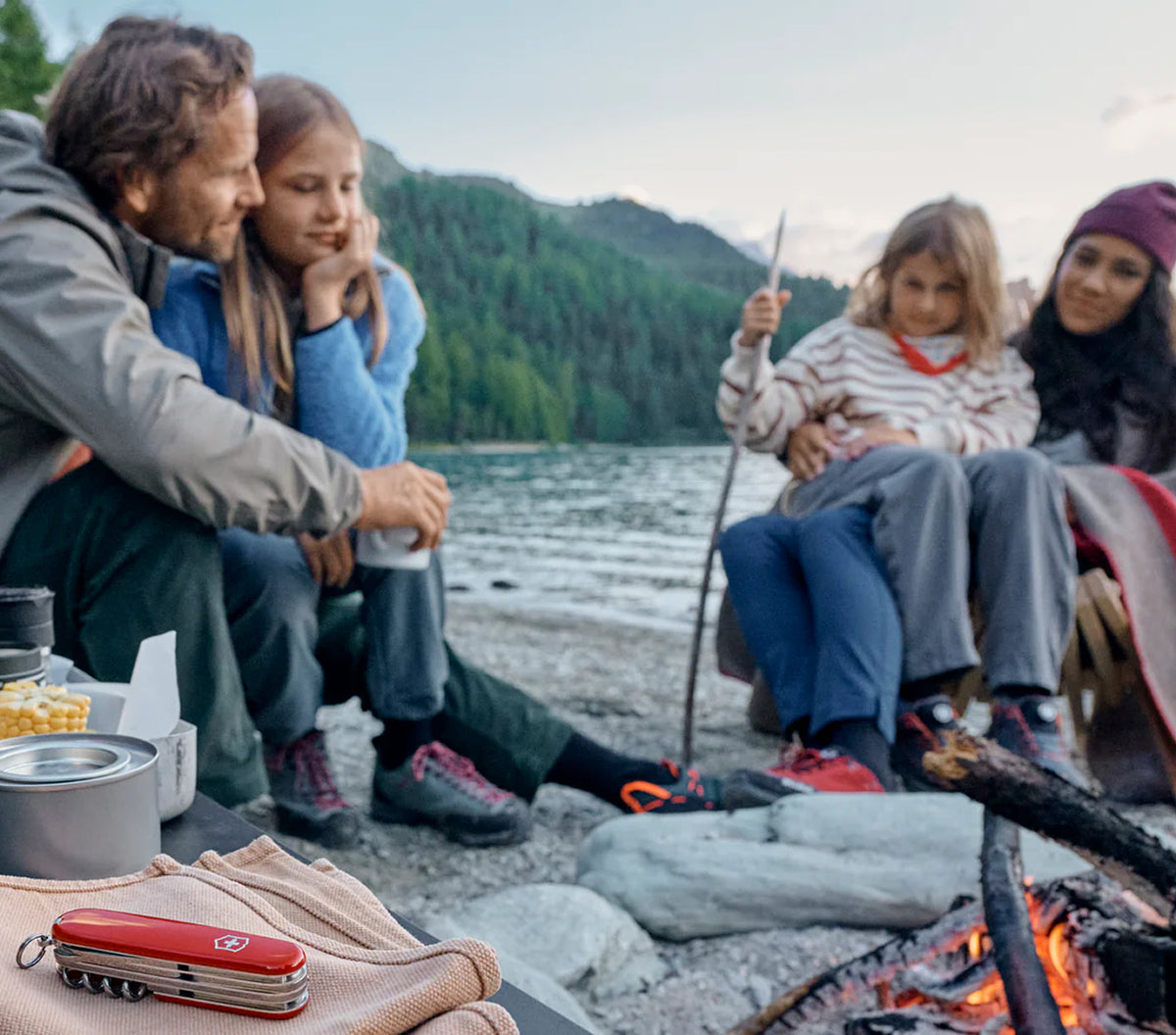 Family camping by the water